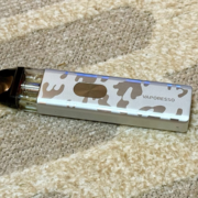 Vaporesso XROS 4 Mini Art Edition pod vape on carpet