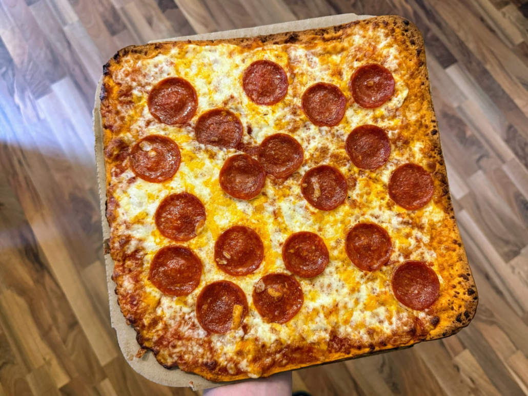 Fully cooked Cheez-It Frozen Pepperoni Pizza showing melted cheese and crispy thin crust