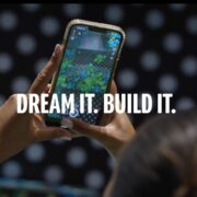 Person using Snapchat Lens Studio on a smartphone with the words “Dream It. Build It.” overlayed