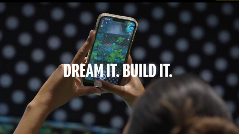 Person using Snapchat Lens Studio on a smartphone with the words “Dream It. Build It.” overlayed