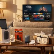 Best Budget Tech Gifts Under $50 (2025) – Tony Reviews Things Cozy living room with small budget tech gifts like a smart speaker, streaming stick, wireless earbuds and a tech organizer pouch on a coffee table, with a TV and a laptop showing the Tony Reviews Things website in the background