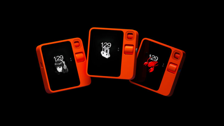 Three orange Rabbit R1 devices arranged on a black background, each showing a different pixel-art watchface