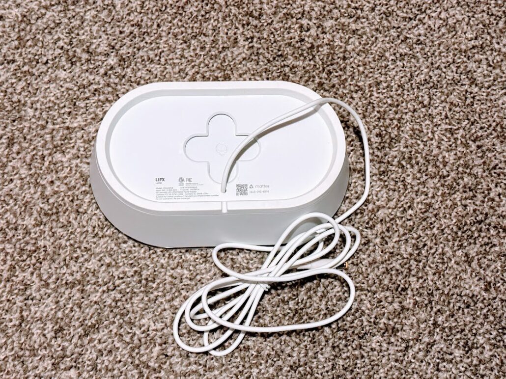 Back of the LIFX Luna showing its model label, power port, wall mount recess, and Matter certification logo