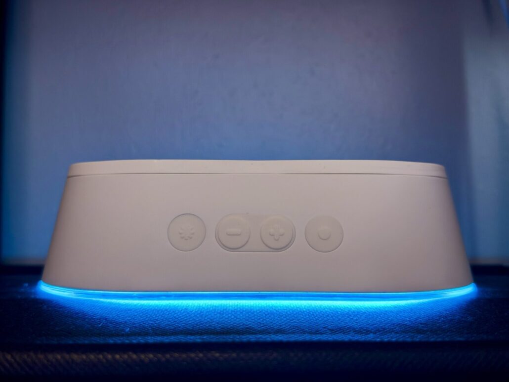 LIFX Luna physical buttons on the front of the lamp above a glowing blue light strip