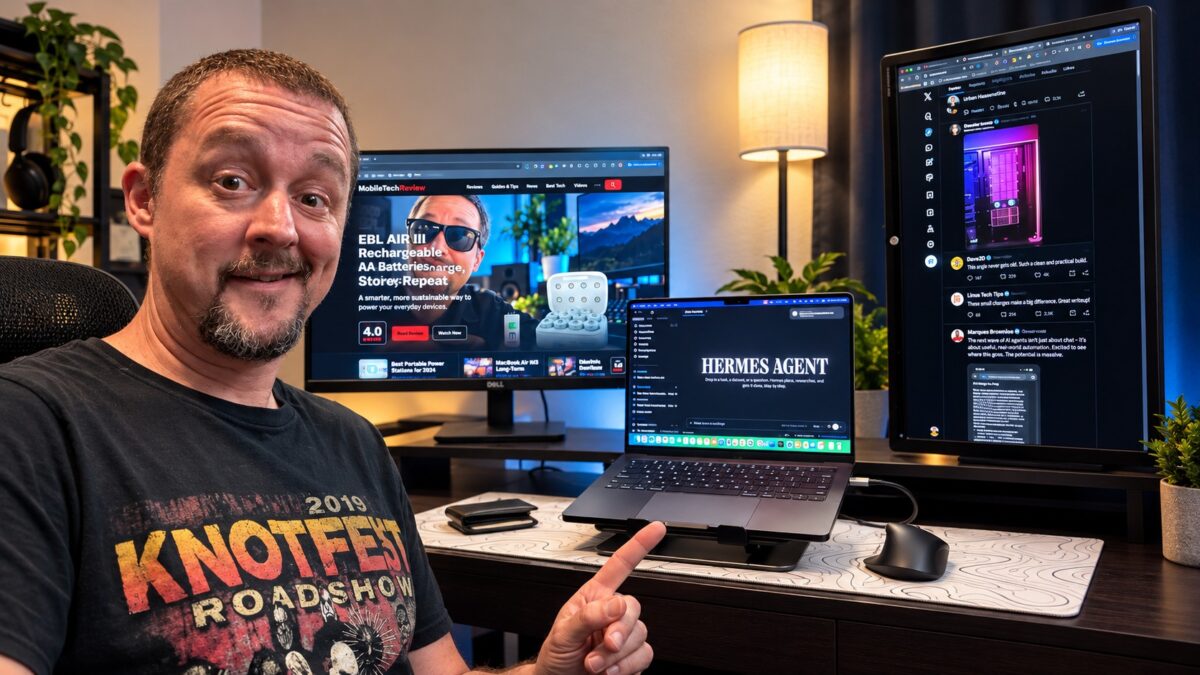 Tony Simons at his desk pointing to a 14-inch MacBook Pro M5 in a dual-monitor development setup